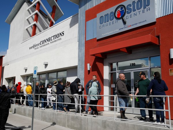 People wait in line for help with unemployment benefits at the One-Stop Career Center, Tuesday, March 17, 2020, in Las Vegas. Nevada Department of Employment, Training and Rehabilitation and it’s partner organizations, like the One-Stop Career Center, have seen an increase in traffic due to the coronavirus. (AP Photo/John Locher)
