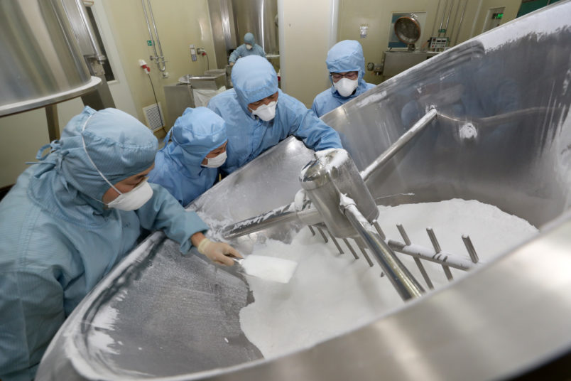 NANTONG, CHINA - FEBRUARY 27 2020: Employees work on the production line of chloroquine phosphate, resumed after a 15-year break, in a pharmaceutical company in Nantong city in east China's Jiangsu province Thursday, Feb. 27, 2020. Chloroquine phosphate, an old drug for the treatment of malaria, has shown some efficacy and acceptable safety against COVID-19 associated pneumonia in trials, according to Chinese media.