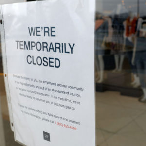 A  GAP store with a Closed sign due to the COVID-19 outbreak in Farmington Hills, Michigan, on March 26, 2020. - The economic shutdown caused by the coronavirus pandemic sparked an explosion of Americans filing for unemployment benefits, surging to 3.3 million last week -- the highest number ever recorded, the Labor Department reported Thursday. (Photo by JEFF KOWALSKY / AFP) (Photo by JEFF KOWALSKY/AFP via Getty Images)