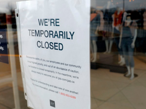 A  GAP store with a Closed sign due to the COVID-19 outbreak in Farmington Hills, Michigan, on March 26, 2020. - The economic shutdown caused by the coronavirus pandemic sparked an explosion of Americans filing for unemployment benefits, surging to 3.3 million last week -- the highest number ever recorded, the Labor Department reported Thursday. (Photo by JEFF KOWALSKY / AFP) (Photo by JEFF KOWALSKY/AFP via Getty Images)