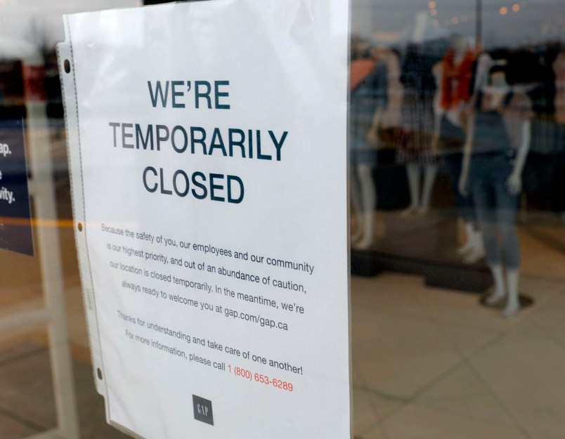 A  GAP store with a Closed sign due to the COVID-19 outbreak in Farmington Hills, Michigan, on March 26, 2020. - The economic shutdown caused by the coronavirus pandemic sparked an explosion of Americans filing for unemployment benefits, surging to 3.3 million last week -- the highest number ever recorded, the Labor Department reported Thursday. (Photo by JEFF KOWALSKY / AFP) (Photo by JEFF KOWALSKY/AFP via Getty Images)