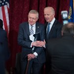 UNITED STATES - DECEMBER 08: Vice President Joe Biden, right, greets retiring Senate Minority Leader Harry Reid, D-Nev., during a portrait unveiling ceremony for Reid in Russell Building's Kennedy Caucus Room, December 08, 2016. (Photo By Tom Williams/CQ Roll Call)