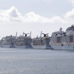 Cruise ships are shown docked at PortMiami, Tuesday, March 31, 2020, in Miami. (AP Photo/Wilfredo Lee)