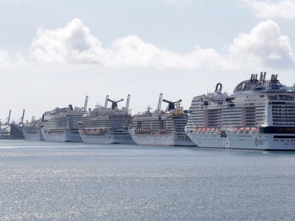 Cruise ships are shown docked at PortMiami, Tuesday, March 31, 2020, in Miami. (AP Photo/Wilfredo Lee)