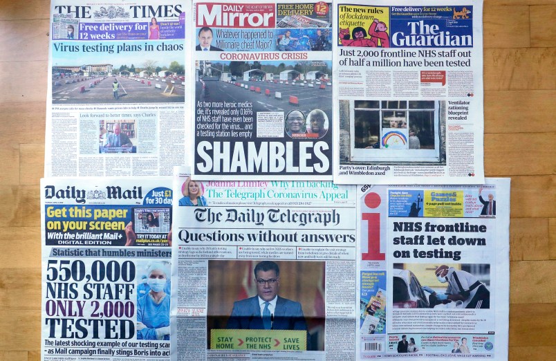 Front Pages of Britain's newspapers showing their coverage of the coronavirus, are displayed in London, Thursday, April 2, 2020. Newspapers in Britain have criticised the lack of testing NHS staff for the virus. The new coronavirus causes mild or moderate symptoms for most people, but for some, especially older adults and people with existing health problems, it can cause more severe illness or death. (AP Photo/Kirsty Wigglesworth)
