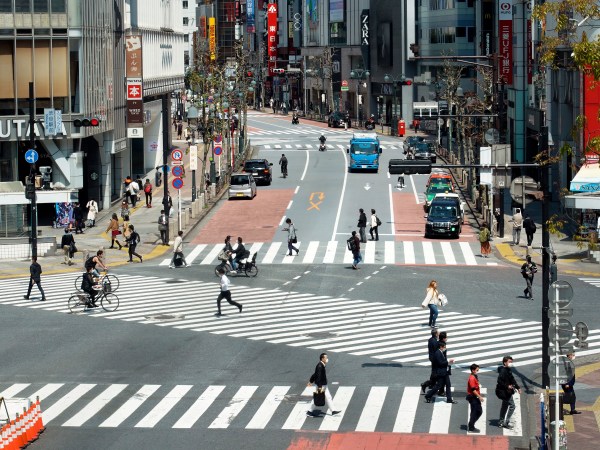 Fewer than usual people at Shibuya Scramble Crossing is seen Wednesday, April 8, 2020, in Tokyo. Japanese Prime Minister Shinzo Abe declared a state of emergency yesterday for Tokyo and six other prefectures to ramp up defenses against the spread of the coronavirus. (AP Photo/Eugene Hoshiko)
