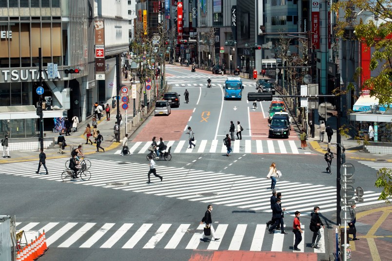 Fewer than usual people at Shibuya Scramble Crossing is seen Wednesday, April 8, 2020, in Tokyo. Japanese Prime Minister Shinzo Abe declared a state of emergency yesterday for Tokyo and six other prefectures to ramp up defenses against the spread of the coronavirus. (AP Photo/Eugene Hoshiko)