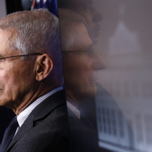 Director of the National Institute of Allergy and Infectious Diseases Dr. Anthony Fauci listens as President Donald Trump speaks during a coronavirus task force briefing at the White House, Saturday, March 21, 2020, in Washington. (AP Photo/Patrick Semansky)