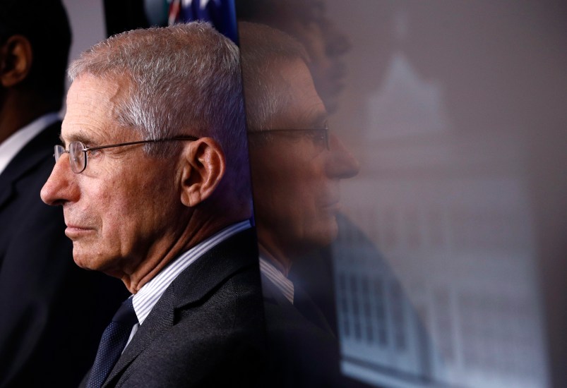 Director of the National Institute of Allergy and Infectious Diseases Dr. Anthony Fauci listens as President Donald Trump speaks during a coronavirus task force briefing at the White House, Saturday, March 21, 2020, in Washington. (AP Photo/Patrick Semansky)