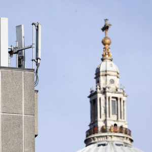 Mobile network phone masts are visible in front of St Paul's Cathedral in the City of London, Tuesday, Jan. 28, 2020. The Chinese tech firm Huawei has been designated a "high-risk vendor" but will be given the opportunity to build non-core elements of Britain's 5G network, the government has announced. The company will be banned from the "core", of the 5G network, and from operating at sensitive sites such as nuclear and military facilities, and its share of the market will be capped at 35%. (AP Photo/Alastair Grant)