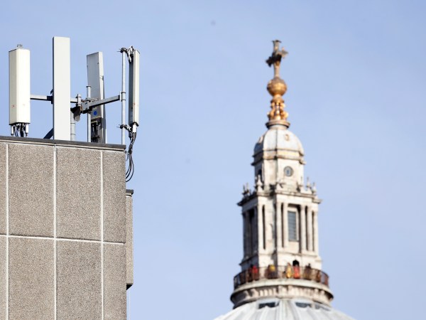 Mobile network phone masts are visible in front of St Paul's Cathedral in the City of London, Tuesday, Jan. 28, 2020. The Chinese tech firm Huawei has been designated a "high-risk vendor" but will be given the opportunity to build non-core elements of Britain's 5G network, the government has announced. The company will be banned from the "core", of the 5G network, and from operating at sensitive sites such as nuclear and military facilities, and its share of the market will be capped at 35%. (AP Photo/Alastair Grant)