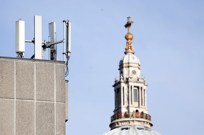 Mobile network phone masts are visible in front of St Paul's Cathedral in the City of London, Tuesday, Jan. 28, 2020. The Chinese tech firm Huawei has been designated a "high-risk vendor" but will be given the opportunity to build non-core elements of Britain's 5G network, the government has announced. The company will be banned from the "core", of the 5G network, and from operating at sensitive sites such as nuclear and military facilities, and its share of the market will be capped at 35%. (AP Photo/Alastair Grant)