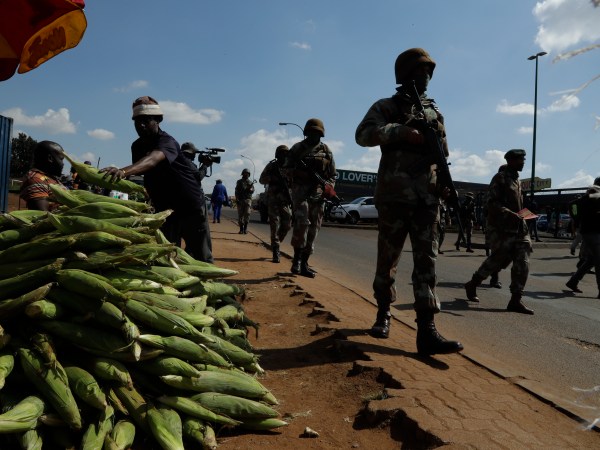 Soldiers patrol the streets of Soweto, South Africa, Thursday, April 23, 2020 as the country remains in lockdown for a fourth week  in a bid to combat the spread of the coronavirus. Africa has registered a 43% jump in reported COVID-19 cases in the last week, highlighting a warning from the World Health Organization that the continent of 1.3 billion could become the next epicenter of the global outbreak(AP Photo/Themba Hadebe)