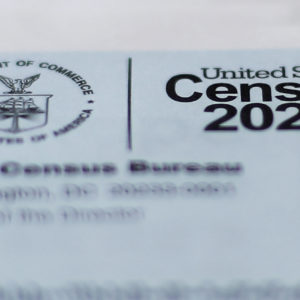 A 2020 census letter mailed to a U.S. resident, is shown in Detroit, Sunday, April 5, 2020. The Census Bureau is required by federal statute to send the president the counts that will be used to carve up congressional districts — known as apportionment — and draw state legislative districts by Dec. 31. The new coronavirus COVID-19 spread forced the U.S. Census Bureau to suspend field operations (AP Photo/Paul Sancya)