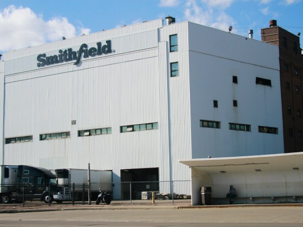 FILE - This Wednesday, April 8, 2020 file photo shows the Smithfield pork processing plant in Sioux Falls, S.D., where health officials reported dozens employees have confirmed cases of COVID-19. On Friday, April 17, 2020, The Associated Press reported on stories circulating online incorrectly asserting that the company's hogs will be raised in the U.S., but slaughtered and packaged for sale in China before being sent back. The false claim has been circulating online since 2014 after Smithfield Foods was sold to Chinese pork giant WH Group in 2013. Jenna Wollin, a spokeswoman for Smithfield Foods, told The Associated Press in an email that the claims circulating online were false. “No Smithfield products come from animals raised, processed, or packaged in China,” she said. (AP Photo/Stephen Groves)