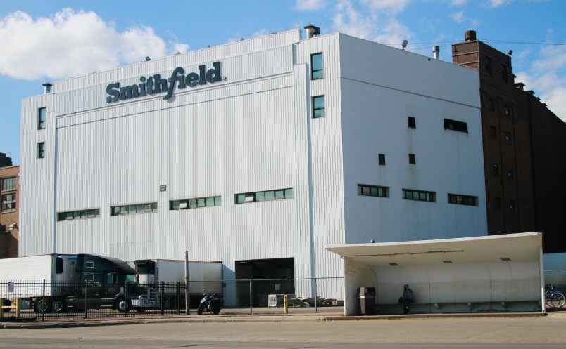FILE - This Wednesday, April 8, 2020 file photo shows the Smithfield pork processing plant in Sioux Falls, S.D., where health officials reported dozens employees have confirmed cases of COVID-19. On Friday, April 17, 2020, The Associated Press reported on stories circulating online incorrectly asserting that the company's hogs will be raised in the U.S., but slaughtered and packaged for sale in China before being sent back. The false claim has been circulating online since 2014 after Smithfield Foods was sold to Chinese pork giant WH Group in 2013. Jenna Wollin, a spokeswoman for Smithfield Foods, told The Associated Press in an email that the claims circulating online were false. “No Smithfield products come from animals raised, processed, or packaged in China,” she said. (AP Photo/Stephen Groves)