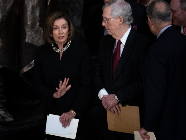 House Speaker Nancy Pelosi (D-CA) and Senate Majority Leader Mitch McConnell (R-KY) talk before the start of a memorial service for late Maryland Representative Elijah Cummings in National Statuary Hall at the U.S. Capitol in Washington, DC on Thursday, October 24, 2019. Cummings died at the age of 68 on October 17 due to complications concerning long-standing health challenges. (Erin Schaff/The New York Times)