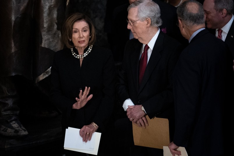 House Speaker Nancy Pelosi (D-CA) and Senate Majority Leader Mitch McConnell (R-KY) talk before the start of a memorial service for late Maryland Representative Elijah Cummings in National Statuary Hall at the U.S. Capitol in Washington, DC on Thursday, October 24, 2019. Cummings died at the age of 68 on October 17 due to complications concerning long-standing health challenges. (Erin Schaff/The New York Times)