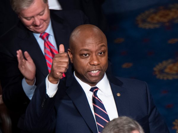 UNITED STATES - FEBRUARY 04: Sen. Tim Scott, R-S.C., is recognized by Present Donald Trump for his work on “opportunity zones” during the State of the Union address in the House Chamber on Tuesday, February 4, 2020. Opportunity zones are designed to bring investments to - low-income communities. (Photo By Tom Williams/CQ Roll Call)