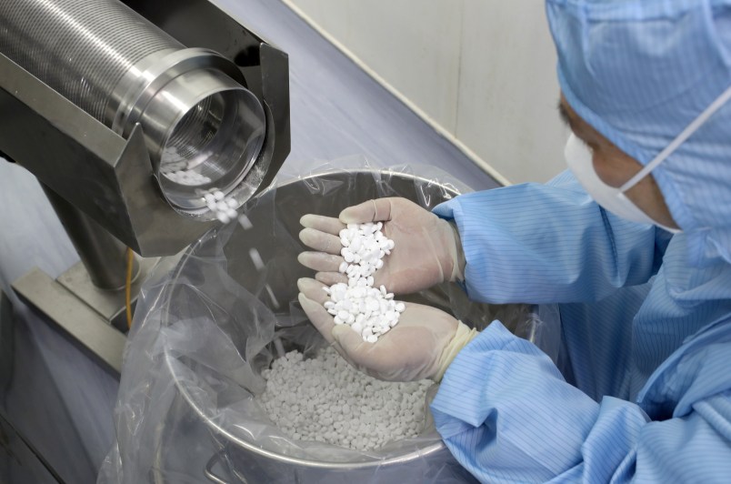 NANTONG, CHINA - FEBRUARY 27 2020: An employee checks the production of chloroquine phosphate, resumed after a 15-year break, in a pharmaceutical company in Nantong city in east China's Jiangsu province Thursday, Feb. 27, 2020. Chloroquine phosphate, an old drug for the treatment of malaria, has shown some efficacy and acceptable safety against COVID-19 associated pneumonia in trials, according to Chinese media.