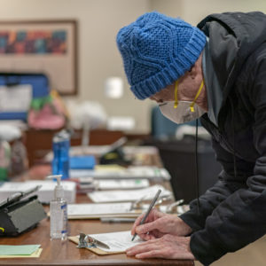 CHICAGO, IL - MARCH 17: Richard Rudberg casts ballots on Illinois' primary election day despite the COVID-19 pandemic in Chicago on March 17, 2020. (Photo by Youngrae Kim for The Washington Post)