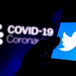 BRAZIL - 2020/04/08: In this photo illustration the Twitter logo seen displayed on a smartphone with a computer model of the COVID-19 coronavirus in the background. (Photo Illustration by Rafael Henrique/SOPA Images/LightRocket via Getty Images)