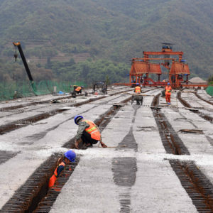 LUFENG, April 28, 2020 -- People work at the construction site of Chahe grand bridge of the Kunming-Chuxiong expressway in southwest China's Yunnan Province, April 28, 2020. The construction of the 2.06-km-long Chahe grand bridge was pushed forward smoothly under strict epidemic prevention measures. (photo by Yang Zongyou/Xinhua via Getty)