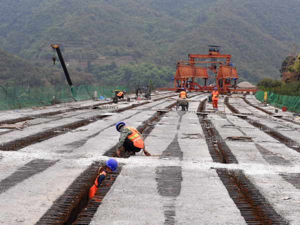LUFENG, April 28, 2020 -- People work at the construction site of Chahe grand bridge of the Kunming-Chuxiong expressway in southwest China's Yunnan Province, April 28, 2020. The construction of the 2.06-km-long Chahe grand bridge was pushed forward smoothly under strict epidemic prevention measures. (photo by Yang Zongyou/Xinhua via Getty)