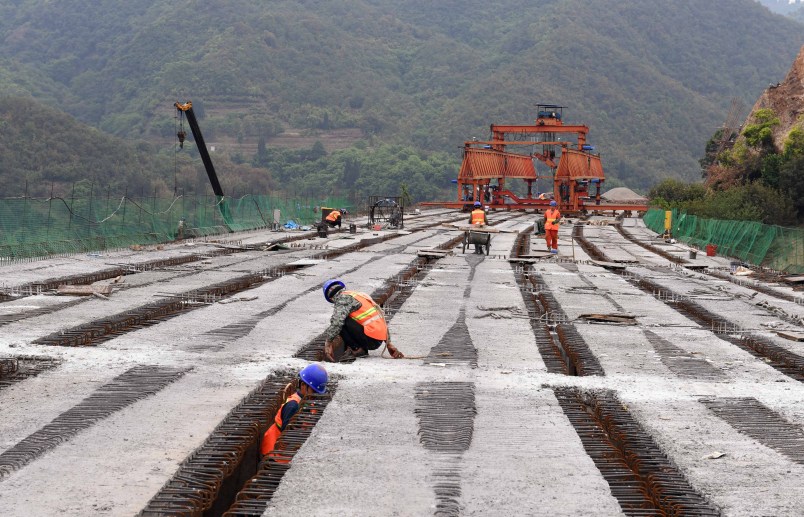LUFENG, April 28, 2020 -- People work at the construction site of Chahe grand bridge of the Kunming-Chuxiong expressway in southwest China's Yunnan Province, April 28, 2020. The construction of the 2.06-km-long Chahe grand bridge was pushed forward smoothly under strict epidemic prevention measures. (photo by Yang Zongyou/Xinhua via Getty)