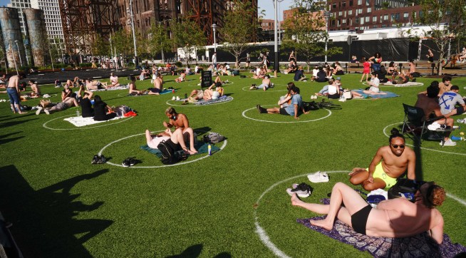 A view of people enjoying the weather at Domino Park in Brooklyn during the coronavirus pandemic on May 16, 2020 in New York City. COVID-19 has spread to most countries around the world, claiming over 308,000 lives with over 4.6 million infections reported. City limiting access in parts of Central Park, Hudson River Park and others to prevent crowds. (Photo by John Nacion/NurPhoto)