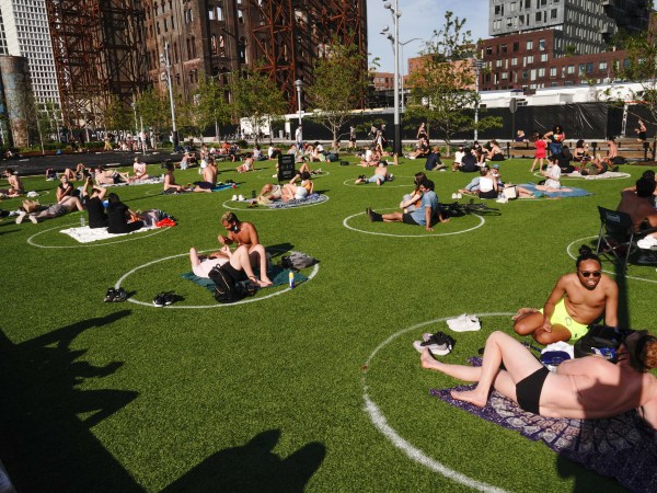 A view of people enjoying the weather at Domino Park in Brooklyn during the coronavirus pandemic on May 16, 2020 in New York City. COVID-19 has spread to most countries around the world, claiming over 308,000 lives with over 4.6 million infections reported. City limiting access in parts of Central Park, Hudson River Park and others to prevent crowds. (Photo by John Nacion/NurPhoto)