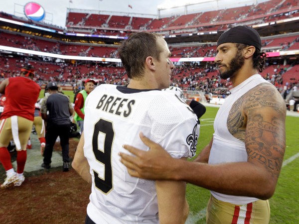 San Francisco 49ers quarterback Colin Kaepernick, right, is greeted by New Orleans Saints quarterback Drew Brees at the end of an NFL football game Sunday, Nov. 6, 2016, in Santa Clara, Calif. New Orleans won the game. (AP Photo/D. Ross Cameron)