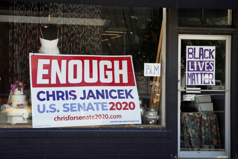 An election sign for Democratic Senate candidate Chris Janicek is seen in Omaha, Neb., Tuesday, June 16, 2020. The Nebraska Democratic Party is calling on its U.S. Senate nominee to drop out of the race after he made sexually repugnant comments about a campaign staffer in a group text with her and other staffers. The party says its state executive committee voted unanimously on Monday to withdraw all of its resources from Chris Janicek’s campaign. (AP Photo/Nati Harnik)