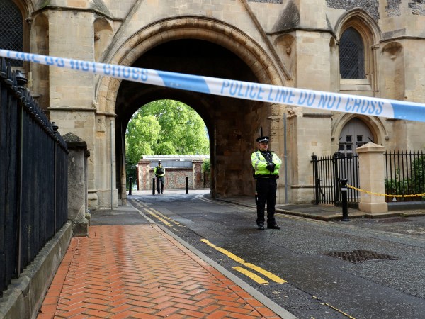 Police at the Abbey gateway of Forbury Gardens in Reading town centre following a multiple stabbing attack in the gardens which took place at around 7pm on Saturday leaving three people dead and another three seriously injured. PA Photo. Picture date: Sunday June 21, 2020. Police said a 25-year-old man from Reading was arrested at the scene on suspicion of murder and is currently in custody. Officers added the incident is not currently being treated as terror-related and they are not looking for anyone else following the attack. See PA story POLICE Reading. Photo credit should read: Jonathan Brady/PA Wire