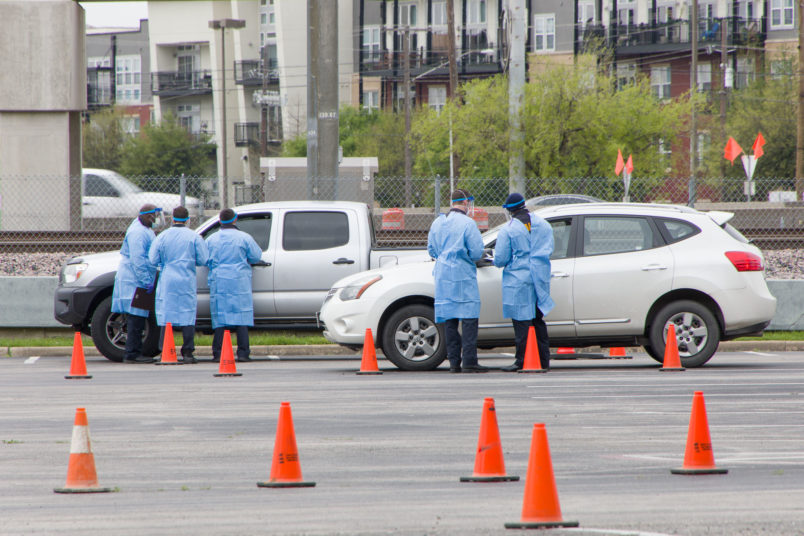 DALLAS, March 22, 2020 . Staff work at a drive-through COVID-19 testing site in Dallas, Texas, the United States, March 21, 2020. The number of COVID-19 cases in the United States topped 20,000 as of 1:30 p.m. Eastern Standard Time on Saturday ,1730 GMT, according to the Center for Systems Science and Engineering ,CSSE, at Johns Hopkins University. (Photo by Dan Tian/Xinhua via Getty)