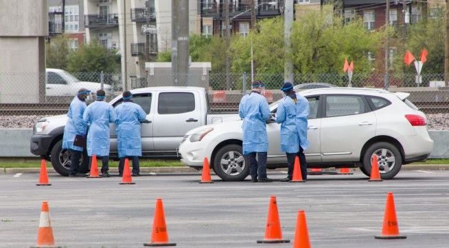 DALLAS, March 22, 2020 . Staff work at a drive-through COVID-19 testing site in Dallas, Texas, the United States, March 21, 2020. The number of COVID-19 cases in the United States topped 20,000 as of 1:30 p.m. Eastern Standard Time on Saturday ,1730 GMT, according to the Center for Systems Science and Engineering ,CSSE, at Johns Hopkins University. (Photo by Dan Tian/Xinhua via Getty)