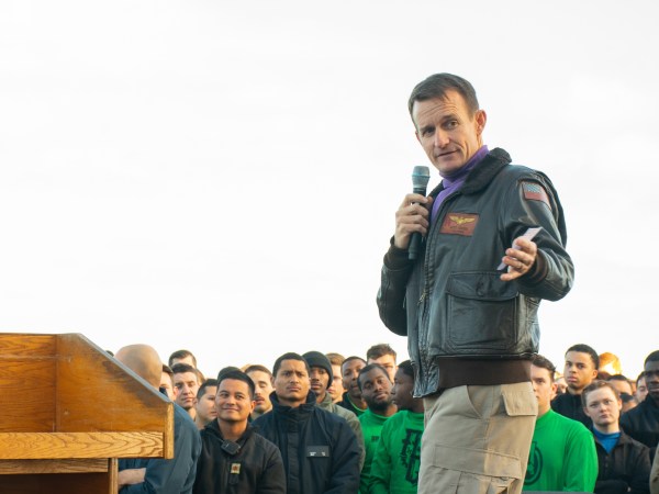 191215-N-KB540-3088 PACIFIC OCEAN (Dec. 19, 2019) Capt. Brett Crozier, commanding officer of the aircraft carrier USS Theodore Roosevelt (CVN 71), gives remarks during an all-hands call on the ship’s flight deck Dec. 15, 2019. Theodore Roosevelt is underway conducting routine training in the Eastern Pacific Ocean. (U.S. Navy photo by Mass Communication Specialist Seaman Alexander Williams)
