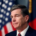 North Carolina Gov. Roy Cooper listens to a question during a briefing on the coronavirus pandemic at the Emergency Operations Center in Raleigh, N.C., Tuesday, May 26, 2020. (Ethan Hyman/Raleigh News & Observer/TNS)