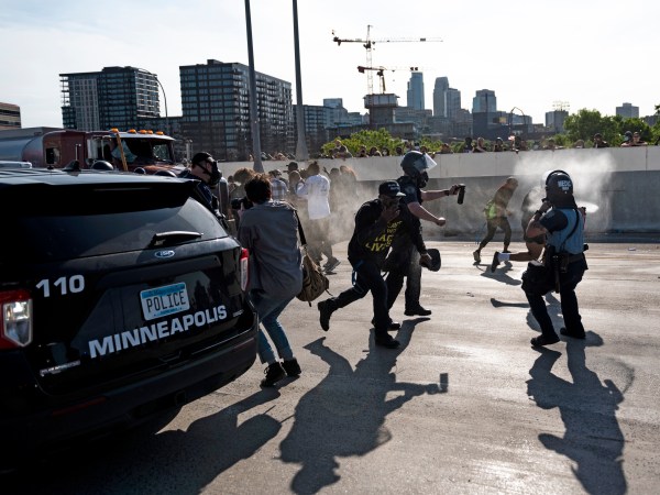 MINNEAPOLIS, MN - MAY 31: Police arrive and spray pepper spray after a tanker truck drove into a peaceful protest on the I-35W bridge over the Mississippi River on May 31, 2020 in Minneapolis, Minnesota. A large group of protesters had been marching over the bridge on both lanes before a truck was driven into the crowd. (Photo by Stephen Maturen/Getty Images)