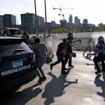 MINNEAPOLIS, MN - MAY 31: Police arrive and spray pepper spray after a tanker truck drove into a peaceful protest on the I-35W bridge over the Mississippi River on May 31, 2020 in Minneapolis, Minnesota. A large group of protesters had been marching over the bridge on both lanes before a truck was driven into the crowd. (Photo by Stephen Maturen/Getty Images)