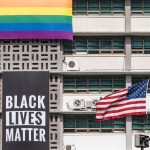 SEOUL, SOUTH KOREA - 2020/06/14: A Black Lives Matter banner, a United States national flag and a rainbow flag are hung on the facade of the US embassy building in Seoul.A Black Lives Matter (BLM) banner is hung on the facade of the US Embassy building in downtown Seoul in solidarity with the BLM protesters who are demanding for a positive change. (Photo by Simon Shin/SOPA Images/LightRocket via Getty Images)