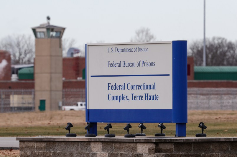 The guard tower flanks the sign at the entrance to the U.S. Penitentiary in Terre Haute, Ind.,  in Terre Haute, Ind., Tuesday, Dec. 10, 2019.  The facility houses a Special Confinement Unit for male federal inmates who have been sentenced to death as well as the federal execution chamber. (AP Photo/Michael Conroy)