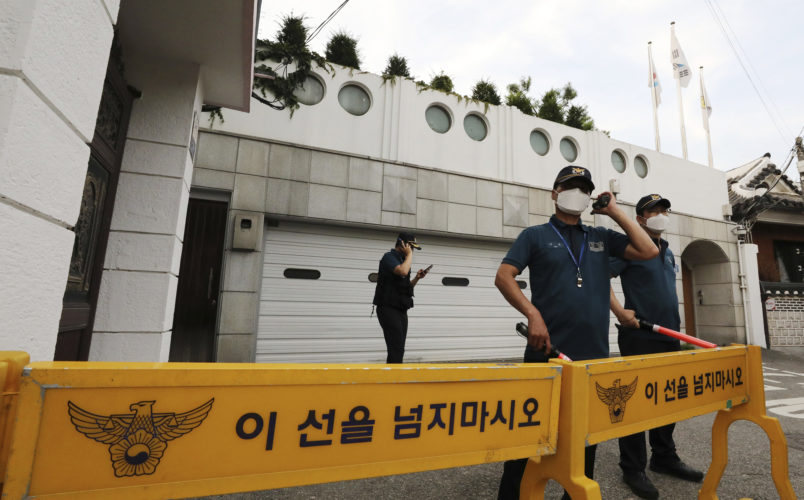 Police officers stand guard in front of the house of Seoul Mayor Park Won-soon in Seoul, South Korea, Thursday, July 9, 2020. The mayor of South Korean capital Seoul has been reported missing and police are searching for him on Thursday. (Park Ju-sung/Newsis via AP)