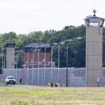 Office patrol the grounds of the federal prison in Terre Haute, Ind., is shown Monday, July 13, 2020. Daniel Lewis Lee, a convicted killer, was scheduled to be executed at 4 p.m. in the . He was convicted in Arkansas of the 1996 killings of gun dealer William Mueller, his wife, Nancy, and her 8-year-old daughter, Sarah Powell. (AP Photo/Michael Conroy)