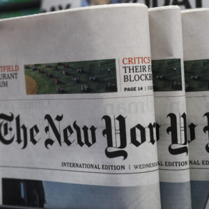 The New York Times newspaper are displayed for sale at a news stand in Hong Kong, Wednesday, July 15, 2020. The New York Times said Tuesday it will transfer some of its staff out of Hong Kong because of the uncertainties about practicing journalism in the Chinese territory under its newly imposed national security law. (AP Photo/Kin Cheung)