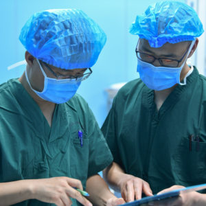 HOHHOT, May 12, 2020 -- Luo Mingchuan L works with his colleague at an operating room of the maternity and child healthcare hospital in Hohhot, north China's Inner Mongolia Autonomous Region, May 11, 2020. Luo Mingchuan, 28, is a nurse working at the maternity and child healthcare hospital of Inner Mongolia Autonomous Region. Amid the COVID-19 outbreak, Luo volunteered to go to central China's Hubei Province to aid the novel coronavirus control efforts there. At the Jianghan temporary hospital in Hubei, Luo has witnessed that patients' condition were improved both physically and mentally. Patients and medical workers have forged a strong relationship by fighting against the COVID-19 pandemic together. "It's great to see my patients get recovered and discharged from the hospital, and it's a touching moment when we waved goodbye," Luo said, "Working in Wuhan is an unforgettable experience, which has made me become more mature." (Photo by Wei Jingyu/Xinhua via Getty)