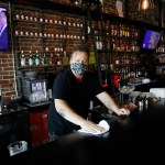 TAMPA, FL - JUNE 26: Zack Vermes a bartender at  Carmine’s Ybor Italian restaurant wipes off the bar while awaiting patrons on June 26, 2020 in Tampa, Florida. Florida has suspended the consumption of alcohol at bars amid a surge in the positive coronavirus cases according to a tweet by Halsey Beshears, the secretary of the state Department of Business and Professional Regulation on Friday.  (Photo by Octavio Jones/Getty Images)