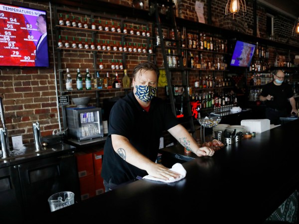 TAMPA, FL - JUNE 26: Zack Vermes a bartender at  Carmine’s Ybor Italian restaurant wipes off the bar while awaiting patrons on June 26, 2020 in Tampa, Florida. Florida has suspended the consumption of alcohol at bars amid a surge in the positive coronavirus cases according to a tweet by Halsey Beshears, the secretary of the state Department of Business and Professional Regulation on Friday.  (Photo by Octavio Jones/Getty Images)