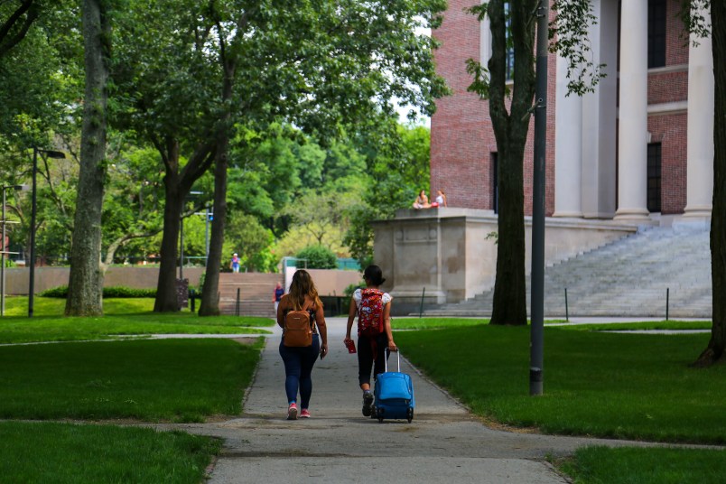 Two students are seen leaving their campus with baggage at Harvard University premises in Cambridge, MA, July 08, 2020. (Photo by Anik Rahman/NurPhoto)