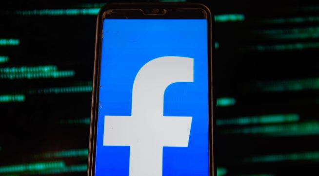 POLAND - 2020/07/15: In this photo illustration a Facebook logo is seen displayed on a smartphone with an European Union flag background. (Photo Illustration by Omar Marques/SOPA Images/LightRocket via Getty Images)